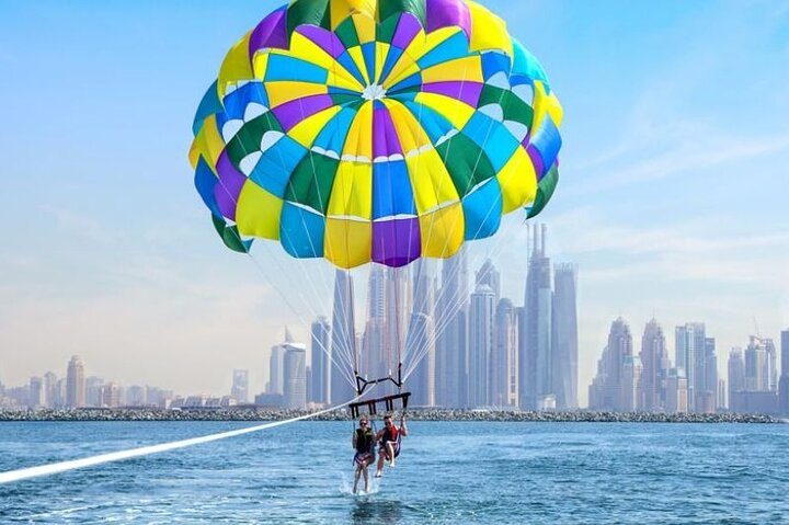 Soar high above the azure waters of Dubai soaking in breathtaking views of iconic skyscrapers while experiencing the excitement of parasailing along Marina Beach. Adventure awaits!